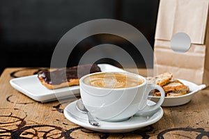 Cappuccino flatwhite coffee with eclair