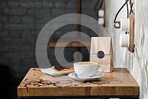 Cappuccino flatwhite coffee with eclair