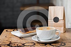 Cappuccino flatwhite coffee with eclair