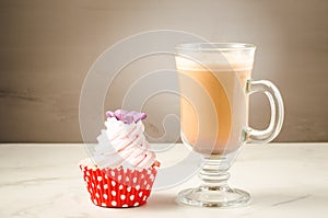 Cappuccino glass and fresh cake with butterfly/cappuccino glass