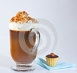 Cappuccino in a glass, Irish glass, ground nut and chocolate chips.A basket of chocolate paste and hazelnuts.