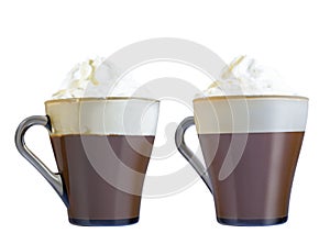 Cappuccino in a glass mug with whipped cream. Isolate on a white background.