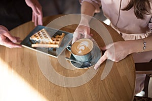 Cappuccino with latte art rosetta