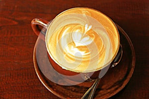 Cappuccino or latte coffee with heart shape