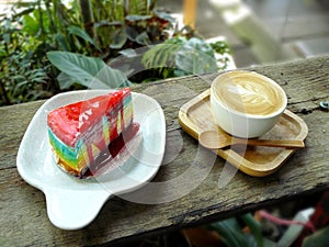 Cappuccino and layer of rainbow crepe cake.
