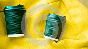 Cappuccino in a plastic glass,on a yellow bag,aromatic coffee,a drink with caffeine,espresso,Close-up,top view. photo