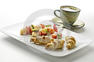 Cappuccino of potato croissants and shrimp skewers and vegetable