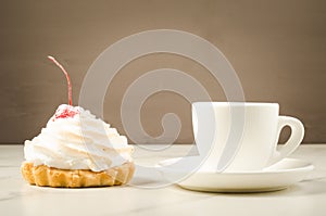 Cappuccino white cup and fresh cake with cherry/cappuccino white