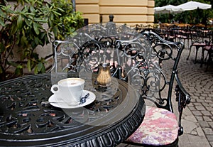 Cappuchino in a cafe outdoors photo