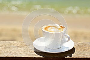 Cappuchino or latte coffe in a white cup with