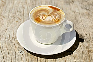 Cappuchino or latte coffe in a white cup with photo