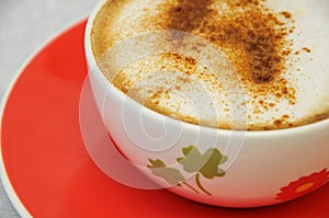 Cappucino on a colorful cup
