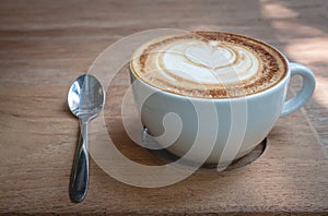 Cappucino on a wood background
