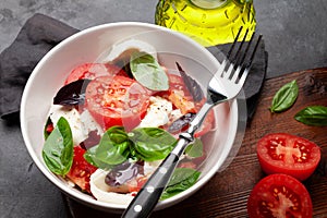 Caprese salad with fresh tomatoes, basil and mozzarella cheese