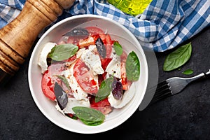 Caprese salad with fresh tomatoes, basil and mozzarella cheese