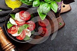 Caprese salad with fresh tomatoes, basil and mozzarella cheese