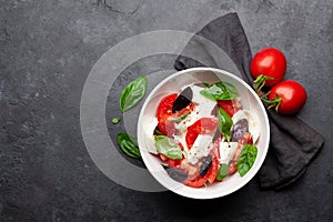 Caprese salad with fresh tomatoes, basil and mozzarella cheese