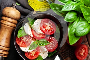 Caprese salad with fresh tomatoes, basil and mozzarella cheese