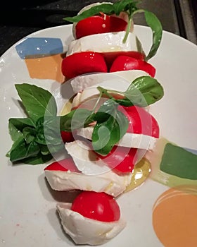 Caprese salad with fresh vine tomatoes and basil   Italy  chef plate