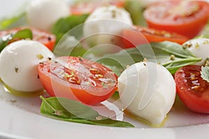 Caprese salad with mini mozzarella balls and