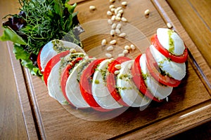 caprese salad. Mozzarella buffalo cheese, tomatoes, bolsamic vinegar, olive oil.