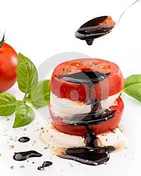 Caprese salad with mozzarella and tomato and balsamic glaze