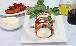 Caprese salad with roasted tomatoes, mozzarella and basil