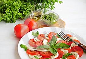 Caprese salad with tomatoes, mozarella cheese and basil