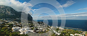 Capri Island vista under cloudy skies after a rainstorm