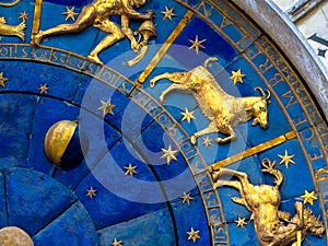 Capricorn astrological sign on ancient clock. Detail of Zodiac wheel with Moon and constellations photo