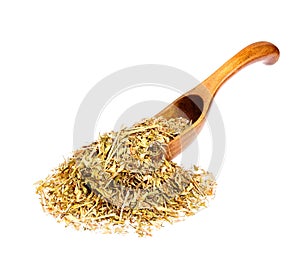 Capsella bursa-pastoris on a wooden spoon isolated on white.