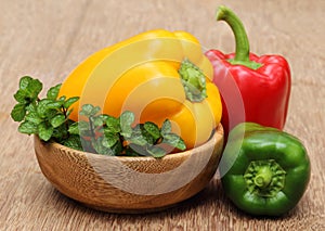 Capsicum with mint leaves on a bowl