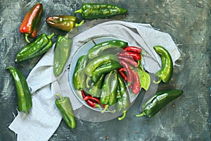 Capsicums red and green, spices on the table, top view, flat ley, harvest concept