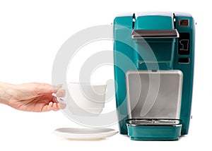 Capsular electric coffee machine cup in hand