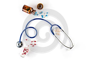Capsule in bottle with Stethoscope and pill cardiology