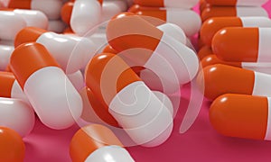 Capsule medicine pills, health pharmacy concept. Drugs for treatment medication. Heap of orange white color capsules on pink backg