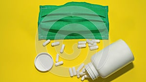 Capsule tablets, vitamins,narcotic drugs,medical mask, top view,close-up.