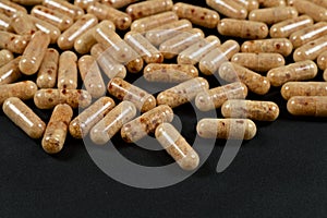 capsules of lecithin on a dark background