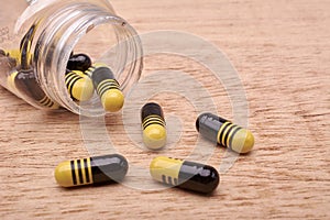 Capsules pills of medicament from transparent bottle