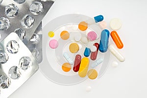 Capsules with vitamin packed insulated on white background.