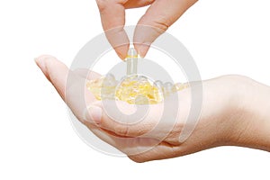Capsules with vitamins in hands