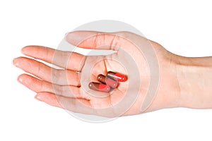 Capsules in woman's hand