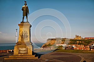 Captain Cook looking over Whitby harbour