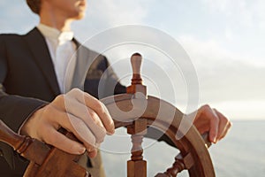Captain. Hands on ship rudder.