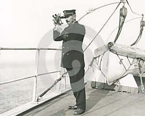 Captain navigating ship photo