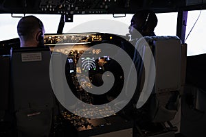 Captain and pilot flying airplane with engine lever and power switch