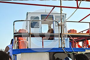 Captains cabin on old fish boat and orange lifebuoy