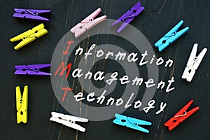 The caption in the picture is Information Management Technology IMT. Notebook sheet, pens photo