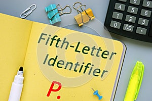 The caption in the picture is P as Fifth-Letter Identifier. Notebook sheet, table, pens