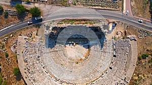 In this captivating aerial video, the remnants of the ancient city of Perge come into view, showcasing a stunning